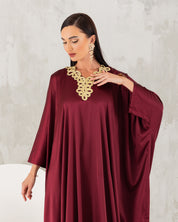 Gold embroidered neckline kaftan.