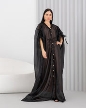 Sheer abaya with vintage buttons.