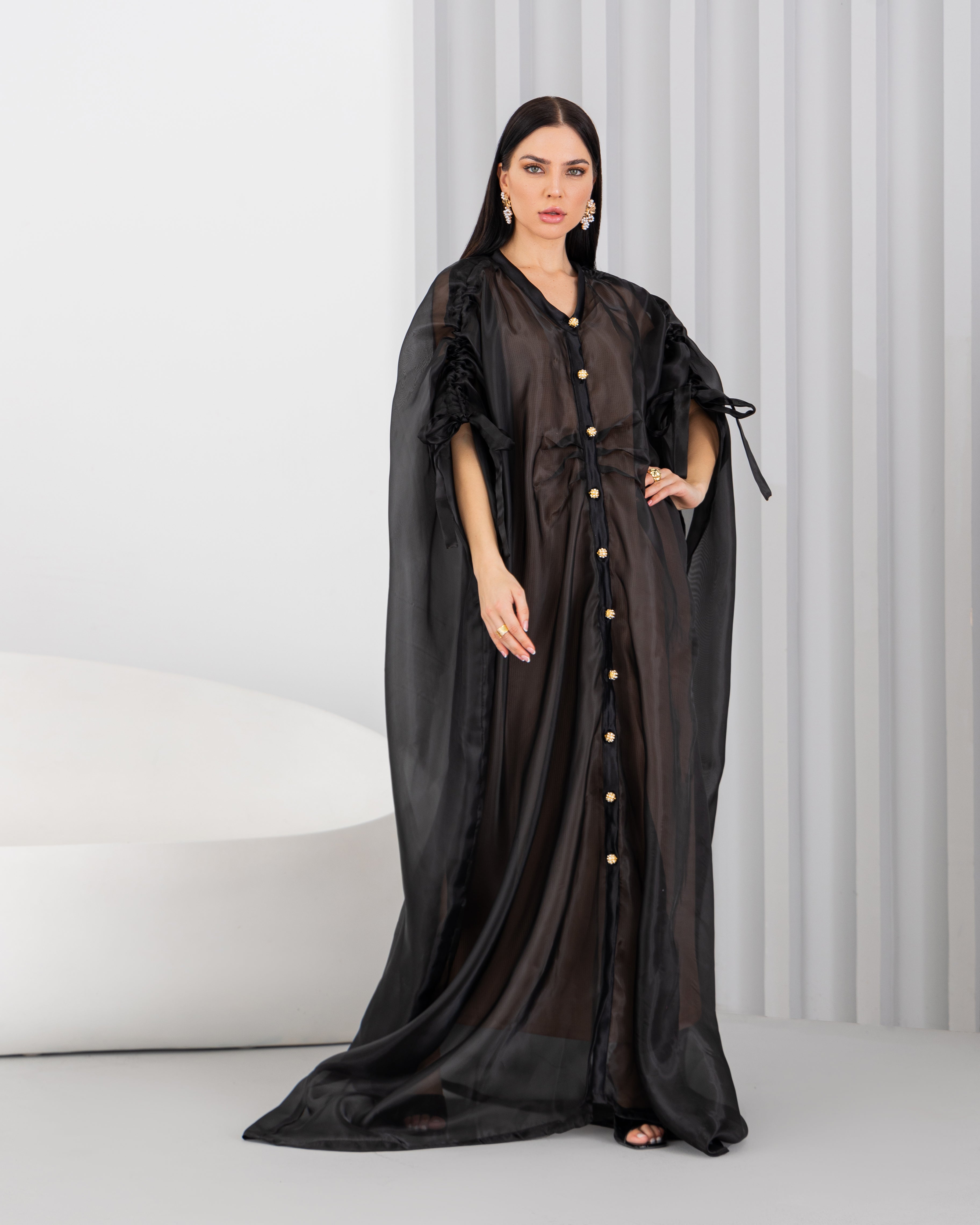 Sheer abaya with vintage buttons.