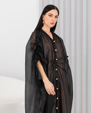 Sheer abaya with vintage buttons.